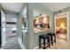 Eat-in kitchen features bar seating and an open floor plan, connecting living spaces at 6365 Bahia Del Mar Blvd # 105, St Petersburg, FL 33715
