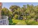 Balcony view overlooking a lush green space with palm trees at 6251 Vista Verde W Dr, St Petersburg, FL 33707