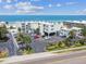 Aerial view of beachfront property with parking and ocean access at 3200 Gulf Blvd # 311, Belleair Beach, FL 33786