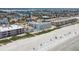 Aerial view of beachfront property with pool and beach access at 3200 Gulf Blvd # 311, Belleair Beach, FL 33786