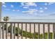 Stunning balcony view of the ocean and beach at 3200 Gulf Blvd # 311, Belleair Beach, FL 33786