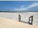 Steps leading to sandy beach with ocean views at 851 Bayway Blvd # 205, Clearwater Beach, FL 33767