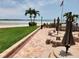 Relaxing patio area with tables, chairs, and ocean views at 851 Bayway Blvd # 205, Clearwater Beach, FL 33767