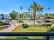 Exterior view of building with palm trees and street parking at 851 Bayway Blvd # 205, Clearwater Beach, FL 33767