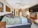 King-size bedroom with ceiling fan and ample closet space at 851 Bayway Blvd # 205, Clearwater Beach, FL 33767