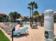 Inviting swimming pool with lounge chairs and shower at 851 Bayway Blvd # 205, Clearwater Beach, FL 33767