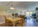 Open concept dining area with light flooring and view into living room at 12760 Indian Rocks Rd # 710, Largo, FL 33774