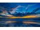 Stunning sunset over the ocean with dramatic clouds at 300 150Th Ave # 411, Madeira Beach, FL 33708