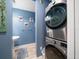Stackable washer and dryer in a small laundry area at 300 150Th Ave # 411, Madeira Beach, FL 33708