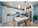 Updated kitchen featuring granite countertops and island seating at 300 150Th Ave # 411, Madeira Beach, FL 33708