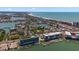 Aerial view of building, marina, and coastline at 300 150Th Ave # 411, Madeira Beach, FL 33708