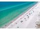 Aerial view of beach with people enjoying the sun and water at 300 150Th Ave # 411, Madeira Beach, FL 33708