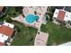 Aerial view of resort-style pool and surrounding patio area at 851 Bayway Blvd # 205, Clearwater Beach, FL 33767
