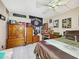 King-size bedroom with ceiling fan and wood dresser at 851 Bayway Blvd # 205, Clearwater Beach, FL 33767