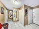 Spacious entryway with tile flooring and mirrored walls at 851 Bayway Blvd # 205, Clearwater Beach, FL 33767