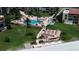 Aerial view of beachfront property with a community pool and patio area at 851 Bayway Blvd # 205, Clearwater Beach, FL 33767