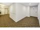 Simple hallway with carpet and elevator access at 851 Bayway Blvd # 205, Clearwater Beach, FL 33767