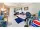 Bedroom with a daybed, ceiling fan, and lots of natural light at 851 Bayway Blvd # 205, Clearwater Beach, FL 33767