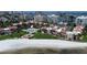 Aerial view of beachfront community with pool and lush landscaping at 851 Bayway Blvd # 205, Clearwater Beach, FL 33767