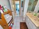 Clean bathroom with double vanity, tiled floors and a shower/tub combo at 851 Bayway Blvd # 205, Clearwater Beach, FL 33767