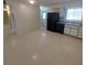 Kitchen with black appliances and light-colored cabinets at 737 Torrey Pines Ave, Sun City Center, FL 33573