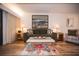 Living room features hardwood floors, a sofa, and a coffee table with decor at 36750 Us 19 # 2052, Palm Harbor, FL 34684