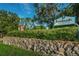 Innisbrook Resort and Golf Club entrance with stone wall and landscaping at 36750 Us 19 # 2052, Palm Harbor, FL 34684