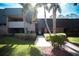 Building exterior with landscaping and walkway at 36750 Us 19 # 2052, Palm Harbor, FL 34684