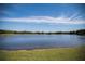 Serene lake view with clear blue skies at 36750 Us 19 # 2052, Palm Harbor, FL 34684