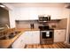 Well-equipped kitchen featuring stainless steel appliances and granite counters at 36750 Us 19 # 2052, Palm Harbor, FL 34684