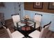 Bright dining area with a round glass table and four chairs at 36750 Us 19 # 2052, Palm Harbor, FL 34684