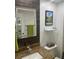 Modern bathroom with illuminated mirror and granite countertop at 36750 Us 19 # 2052, Palm Harbor, FL 34684