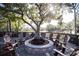 Relaxing fire pit surrounded by chairs on the patio at 36750 Us 19 # 2052, Palm Harbor, FL 34684