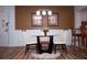 Charming dining area with a round glass table and four beige chairs at 36750 Us 19 # 2052, Palm Harbor, FL 34684