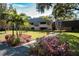 Building exterior with lush landscaping and palm trees at 36750 Us 19 # 2052, Palm Harbor, FL 34684