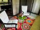 Comfortable patio with chairs and a colorful rug at 36750 Us 19 # 2052, Palm Harbor, FL 34684