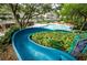 Water slide at the community swimming pool with a pool view at 36750 Us 19 # 2052, Palm Harbor, FL 34684