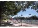 Enjoy tennis courts and seating area shaded by mature trees at this community's recreation area at 36750 Us 19 # 2052, Palm Harbor, FL 34684