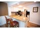 Updated kitchen with granite countertops and breakfast bar at 36750 Us 19 # 2052, Palm Harbor, FL 34684
