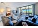 Cozy living room with comfortable seating and a view of the lanai at 1801 Mariner Dr # 20, Tarpon Springs, FL 34689