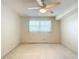 Bright bedroom with neutral walls, carpet, and a large window at 8174 Terrace Garden N Dr # 207, St Petersburg, FL 33709