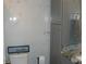 Clean bathroom with marble tile and gray vanity at 1857 Bough Ave # C, Clearwater, FL 33760