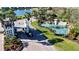 Community entrance with lush landscaping, a water feature, and gatehouse at 1010 Tidewater Shores Loop # 106, Bradenton, FL 34208