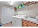 Laundry room with washer, dryer, and shelving at 7296 Marathon Dr # 504, Seminole, FL 33777
