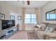 Cozy guest room featuring a comfortable sofa, large window, and neutral decor at 7296 Marathon Dr # 504, Seminole, FL 33777