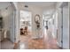 Bright hallway showcasing views into the kitchen and dining area at 7296 Marathon Dr # 504, Seminole, FL 33777