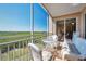 Relaxing screened balcony with outdoor furniture and scenic views at 7296 Marathon Dr # 504, Seminole, FL 33777