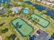 Two well-maintained tennis courts near a community pool at 7296 Marathon Dr # 504, Seminole, FL 33777