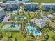 Stunning aerial view of community with pools, tennis courts, and water access at 7296 Marathon Dr # 504, Seminole, FL 33777