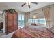 Bedroom with king-size bed and balcony access at 7296 Marathon Dr # 504, Seminole, FL 33777